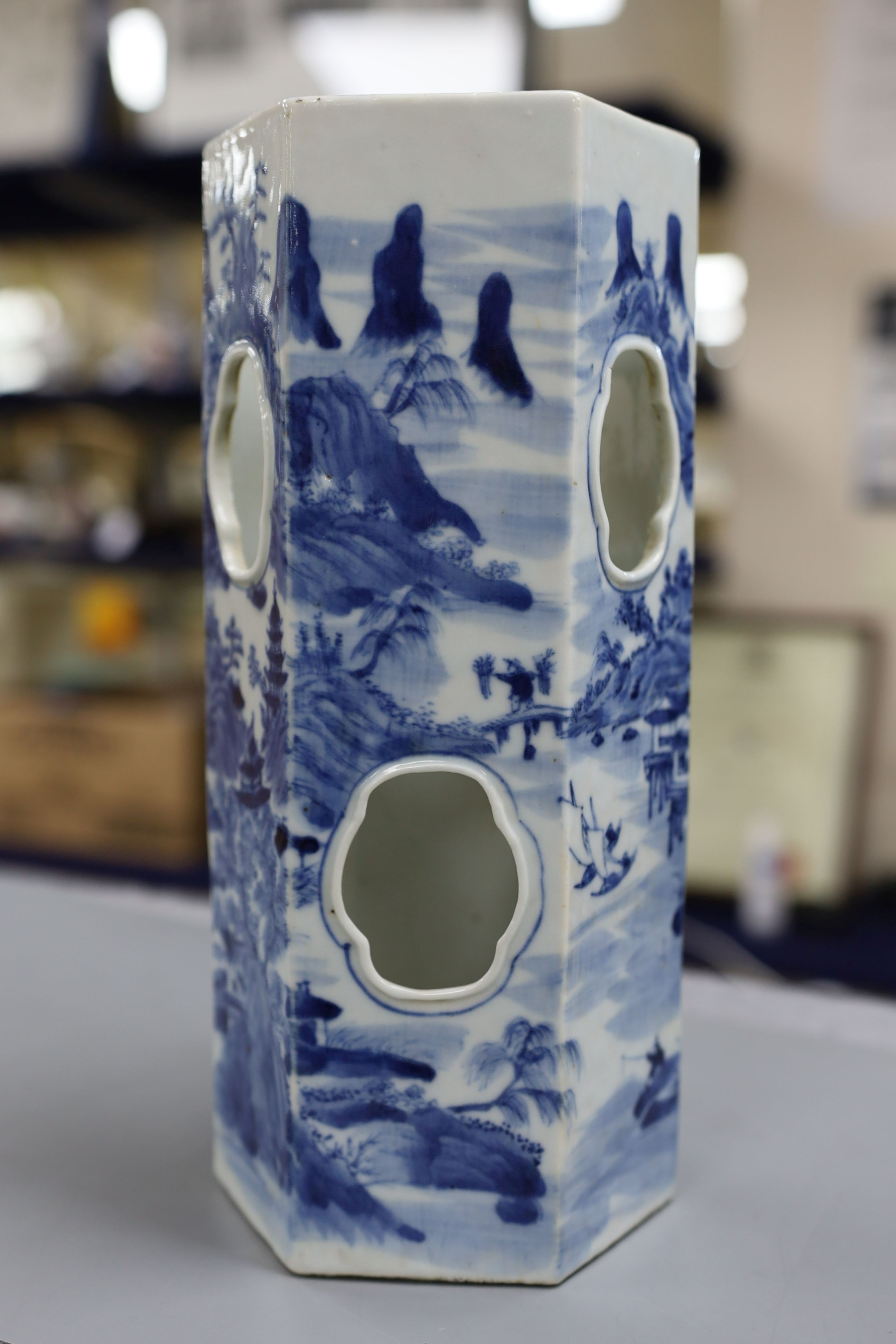 A Chinese blue and white hexagonal hat stand, late 19th century, 27.5 cms high, 27.2 cm high, hairline crack to one side of body